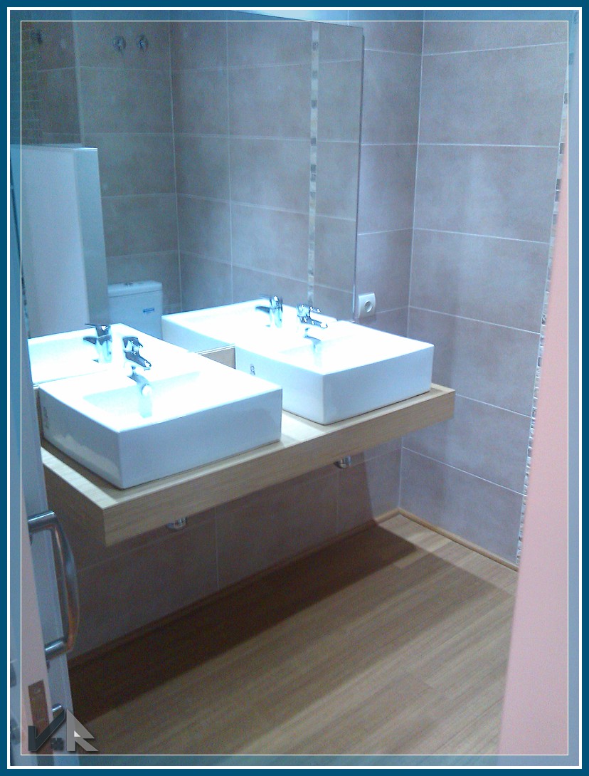modern family bathroom Valencia double sink wood vanity and circular bathtub